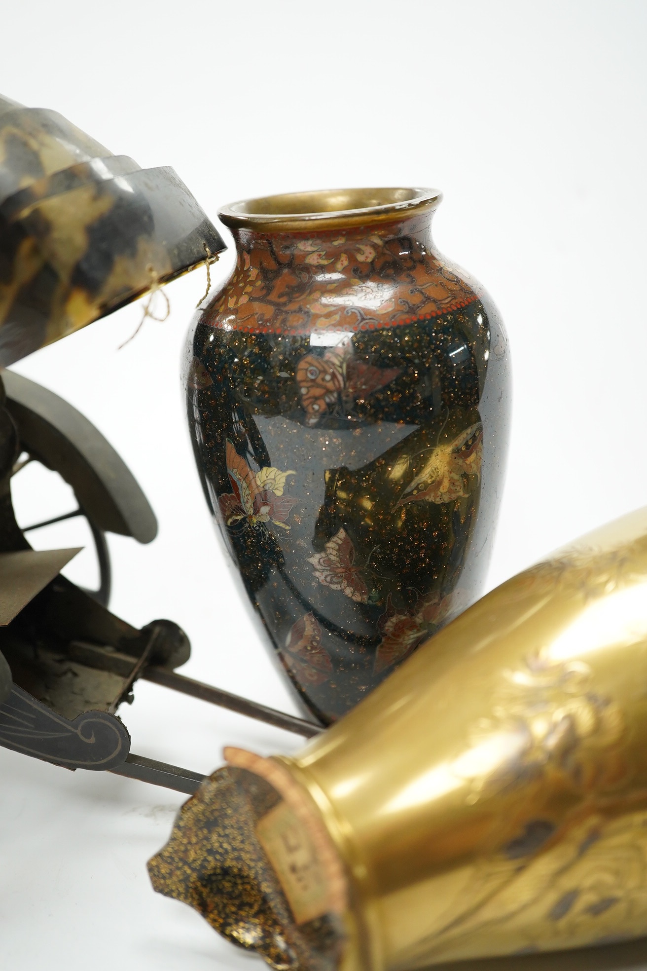 A damaged 19th century Japanese lacquer vase, a Japanese cloisonné enamel vase and a model tortoiseshell and lacquer rickshaw, rickshaw 20cm long., Condition - poor to fair